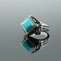 Vintage stainless steel ring with a turquoise stone inlay on a mirrored background - US 7 / Artificial Turquoise Style