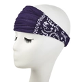 Macro detail of wide elastic paisley headband in deep purple for yoga and sports - Deep purple