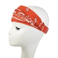 Close-up of orange paisley print elastic headband on a white mannequin head display - Orange