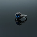 Vintage silver finish ring featuring a deep blue gemstone with ornate floral carvings - Blue Stone Ring