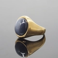 Polished gold-tone signet ring featuring a large oval dark blue cabochon gemstone - US 7 / Gold Base Gray Cat's Eye