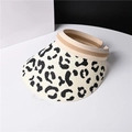 Detail view of woven straw sun visor with stylish black and white leopard print brim - One Size / Cream
