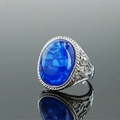 Vintage stainless steel ring featuring a large oval blue stone with an engraved silver band - Size 8 / Silver Tone Blue Stone