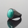 Minimalist black stainless steel ring featuring a dark green oval cat eye gemstone - US 7 / Black Base Green Cat's Eye