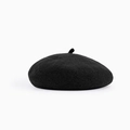 Close-up of the soft texture and fine stitching on this classic black wool beret cap - M / Black