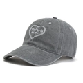 Close-up of heart-shaped Ofr Paris embroidery on a washed grey vintage baseball cap - Gray