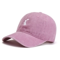Pink washed cotton baseball cap featuring a white rabbit embroidery in a 45-degree side view - Adjustable / Pink