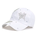 Stylish white baseball cap with rhinestone butterfly design and curved brim for women - Adult / White