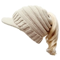 Beige knitted ponytail beanie with soft fleece lining and pompom for outdoor warmth - Adjustable / Beige