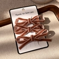 Three-piece velvet bow hair clips set in vintage rose pink on a display card - Bowknot Hair Clip (24346B) / Pink