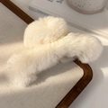Detail view of large cream plush hair claw clip with soft faux rabbit fur texture - Cream