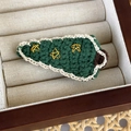 Macro view showing the detailed knit texture and gold star embroidery on the Christmas tree clip - Star Topped White Edge Christmas Tree (24450C)