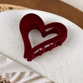 Detail shot of vintage dark red velvet heart-shaped hair claw clip on a white plate - Wine Red Heart