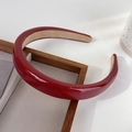 Close-up of deep red glossy patent leather headband with soft non-slip velvet lining - Red