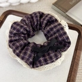 Detailed view of purple tweed scrunchie with lace edge and small black bow decoration - Purple Mochi Hounds-tooth