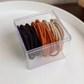 Elastic hair ties in caramel tones stored in a transparent square acrylic box - Three Color Maple Mix (18104C)