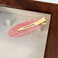 Detail of pink resin hair clip with glitter texture on gold metal base in display box - Jelly Pink