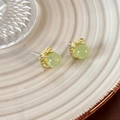 Detailed close-up of light green bead earrings set in square gold hammered metal frames - Jelly Green