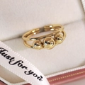 Close-up of double-layered gold ring with three beads in a gift box with ribbons - Double Layer Three Beads Style (13333B)