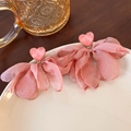 Detail of pink heart stud earrings with soft layered chiffon flower petals on a ceramic dish - Pink Heart Tassel (23511)