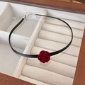 Detailed close-up of dark red velvet rose pendant on a black cord choker with silver clasp - 14# Red Flower Pendant Black String (24308)