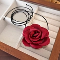 Close-up of handmade dark red silk rose choker on a beige velvet jewelry storage box - 22# Dark Red Satin 3D Rose (24443B)