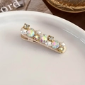 Détail de la pince à cheveux étoile rose avec perles et strass sur plat céramique - Beige (25060A)