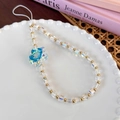 Detail of colorful glass beads and blue gradient crystal flower charm on white cord - Colorful Blue Flower