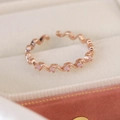 Macro shot of rose gold zigzag wavy ring with pink zircon accents in velvet jewelry box - Adjustable Open / Pink Zircon Wave Style(25092A) / Rose Gold