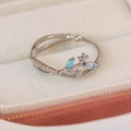 Macro shot of adjustable silver ring featuring blue marquise crystals and flower details - Blue Zircon Flower Branch Style(25094B)