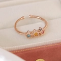 Macro view of adjustable rose gold star ring with colorful cubic zirconia inlay stones - Pentagram Star Style(25095A)