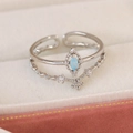 Detail of silver double-layered open ring with blue marquise stone and floral accent - Blue Zircon Tear Style(25098B)