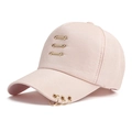 Close-up of pink cotton baseball cap with gold metal rings and decorative bars - One Size / Pink