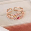 Detailed macro view of rose gold double-layer floral ring with colorful zircon stones - Three Zircon Five Flower Three Leaf Style(25102A)