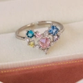 Detail of adjustable ring featuring a multi-colored zircon heart on beige velvet - Multi-color Zircon Big Heart Style(25105B)