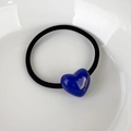 Detail of blue resin heart charm on elastic hair tie with gold Barrette La France text - Blue Heart