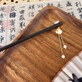 Detail of sandalwood style hair stick featuring white flower and jade rabbit tassel with pearls - Pearl Tassel Rabbit