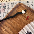 Detail of sandalwood style hair stick featuring white jade rabbit and red bead tassel - Red Bead Tassel Rabbit