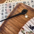 Detailed close-up of a wood hair pin with a rabbit and moon pendant in a vintage setting - Auspicious Cloud Moon Rabbit