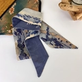 Detail view of a landscape print silk scarf with love text and Chinese artistic elements - Peach Blossom Spring (F)