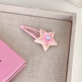 Detailed view of Y2K star hair clip with pink resin layers and blue star on beige tray - Pink Five-pointed Star (23588A)