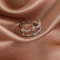 Close-up of double-layered silver ring with colorful zircon stones on brown silk - Silver Double Layer Blue Main Stone (23939)