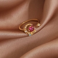 Detailed macro view of gold star and moon open ring with red stone on brown satin fabric - Gold Star Moon Purple Rhinestone Style (23942)