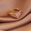 Macro shot of gold-plated ring featuring pink heart zircon and micro-pave detailing - Gold Pink Heart Style (23946)