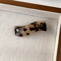 Close-up of tortoise shell pattern acetate wave hair clip with gold handmade lettering - Light Tortoiseshell