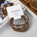 Detail of mocha brown elastic hair ties with gold beads on a minimalist card - Set of 5 / Light Coffee