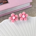Close-up of pink velvet flower earrings on a decorative tray with soft petals - Deep Pink Petals Light Pink Core (24168G)