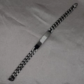 Black and silver Cuban link bracelet with a polished rectangular bar on grey fabric - Black 10mm