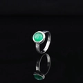 Minimalist silver ring with green round gemstone on reflective black background - US 6 / Silver Band Green Gemstone