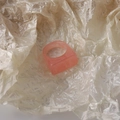 Detail of pink resin ring with marble texture on pearlescent crinkled paper background - Pink Square
